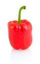 Sweet red bell pepper with green stem on white background with shadow reflection.