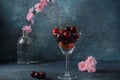 Sweet red cherries in a glasses. Cherry close-up in a glass with water drops.