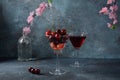 Sweet red cherries in a glasses. Cherry close-up in a glass with water drops.