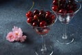 Sweet red cherries in a glasses. Cherry close-up in a glass with water drops.