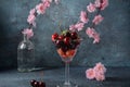 Sweet red cherries in a glasses. Cherry close-up in a glass with water drops.