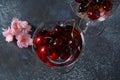 Sweet red cherries in a glasses. Cherry close-up in a glass with water drops.