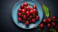Sweet red cherries with leafs on plate dark background. Top view. Free space for text. Food photography. Horizontal format, AI Royalty Free Stock Photo