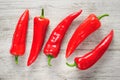 Sweet red Kapia peppers on a white wood background Royalty Free Stock Photo