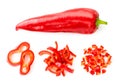 Sweet red pepper and three piles of sliced pieces, set on a white background. The view of top. Royalty Free Stock Photo