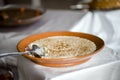 Sweet rice with cinnamon is traditional Portuguese dessert