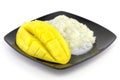 Sweet rice in a plate a yellow ripe sweet beautifulmango fruit and mango slice with cubes isolated white background. Royalty Free Stock Photo