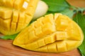 Sweet ripe mangos cut - Mango slice and mango leaves from tree tropical summer fruit concept Royalty Free Stock Photo