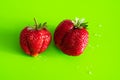Red ripe berry of strawberry on green Matt background Royalty Free Stock Photo