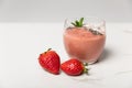 Sweet ripe strawberries near tasty smoothie