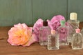 Sweet roses and vintage perfume bottles collection. Royalty Free Stock Photo