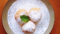 Sweet round bread with sugar powder on plate