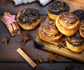 Sweet round buns with cinnamon and poppy seeds close up Royalty Free Stock Photo