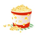 Sweet or salty popcorn in big paper cup on napkin. Maize corns.