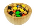 Side view of a portion of sweet and salty trail mix in a wood bowl isolated on a white background Royalty Free Stock Photo