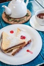 Sweet sandwiches with black tea on the blue wooden table