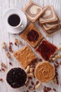 Sweet sandwiches with jelly, peanut butter and coffee top view Royalty Free Stock Photo