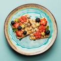 Sweet sandwiches peanut butter with fruits, berries with honey on a plate, top view. Royalty Free Stock Photo