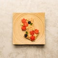 Sweet sandwiches peanut butter with fruits, berries with honey on a wooden board, top view. Royalty Free Stock Photo