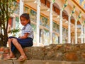 Sweet School Girl in Uniform Ouside Temple in Rural Cambodia