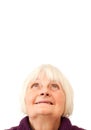 Sweet senior woman looking up at copyspace Royalty Free Stock Photo