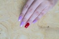 Sweet shiny baby violet and dark red colr gel polish painting on long square shape woman fingernail