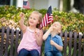 Sweet Sister and Brother Playing with American Flags Royalty Free Stock Photo