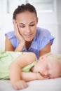 Sweet, sleeping and mother with baby on bed for bonding, relax and happy cute relationship. Love, smile and young mom Royalty Free Stock Photo