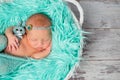 Sweet sleeping newborn girl with flowers on headband Royalty Free Stock Photo