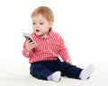 Sweet small baby with mobile phone.