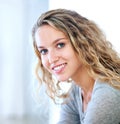 A sweet smile just for you. Portrait of a pretty young blonde smiling at you sweetly. Royalty Free Stock Photo