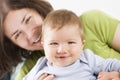 Sweet smiling baby boy laughing together with his mother. Royalty Free Stock Photo