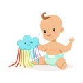 Sweet smiling baby in a diaper playing with toy cloud, colorful cartoon character vector Illustration