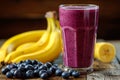 Sweet smoothie or milkshake with banana and blueberries. Purple colorful fruit juice milkshake. Diet smoothie with yogurt or milk Royalty Free Stock Photo