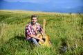 Sweet song. western camping and hiking. sexy man with guitar in checkered shirt. country music song. cowboy man with Royalty Free Stock Photo