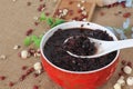 Sweet soup of black bean in chinese style on red bowl Royalty Free Stock Photo