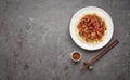 Sweet and Sour fried pork chunks with vegetables and rice on grey stone background. Top view with copy space Royalty Free Stock Photo