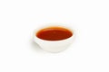 Sweet and sour sauce in a bowl on a white plate. For the restaurant menu. Traditional Japanese sushi seasoning. Healthy eating