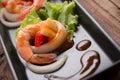 Sweet and sour shrimp, prawn cocktail on long square dish and wo Royalty Free Stock Photo