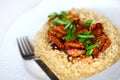 Sweet and sour tofu with quinoa and scallions