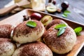 Sweet steamed dumplings with a plum jam, sprinkled with cocoa powder