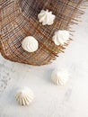 Sweet still life, white meringue on brown cloth on the table Royalty Free Stock Photo