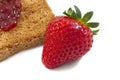 Sweet strawberries jam on toast close up Royalty Free Stock Photo