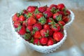 Sweet strawberries in the little basket. Symbol of love. Heart shape bowl, summer juicy strawberries . Strawberry white heart in a Royalty Free Stock Photo