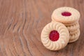 sweet strawberry inside cookie on wood background. Royalty Free Stock Photo