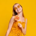 Sweet Summer. Carefree Teen Girl Holding Bright Lollipop And Smiling At Camera Royalty Free Stock Photo