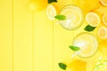 Summer lemonade top view corner border on a yellow wood background Royalty Free Stock Photo