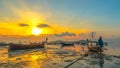 Sweet sunrise above fishing boats on the beach. Royalty Free Stock Photo