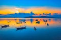 Sweet sunrise above fishing boats on the beach. Royalty Free Stock Photo