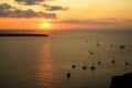 Sweet sunset scenic ocean view in vast Aegean sea with sailing ships silhouette, abstract cloud and light reflection Royalty Free Stock Photo